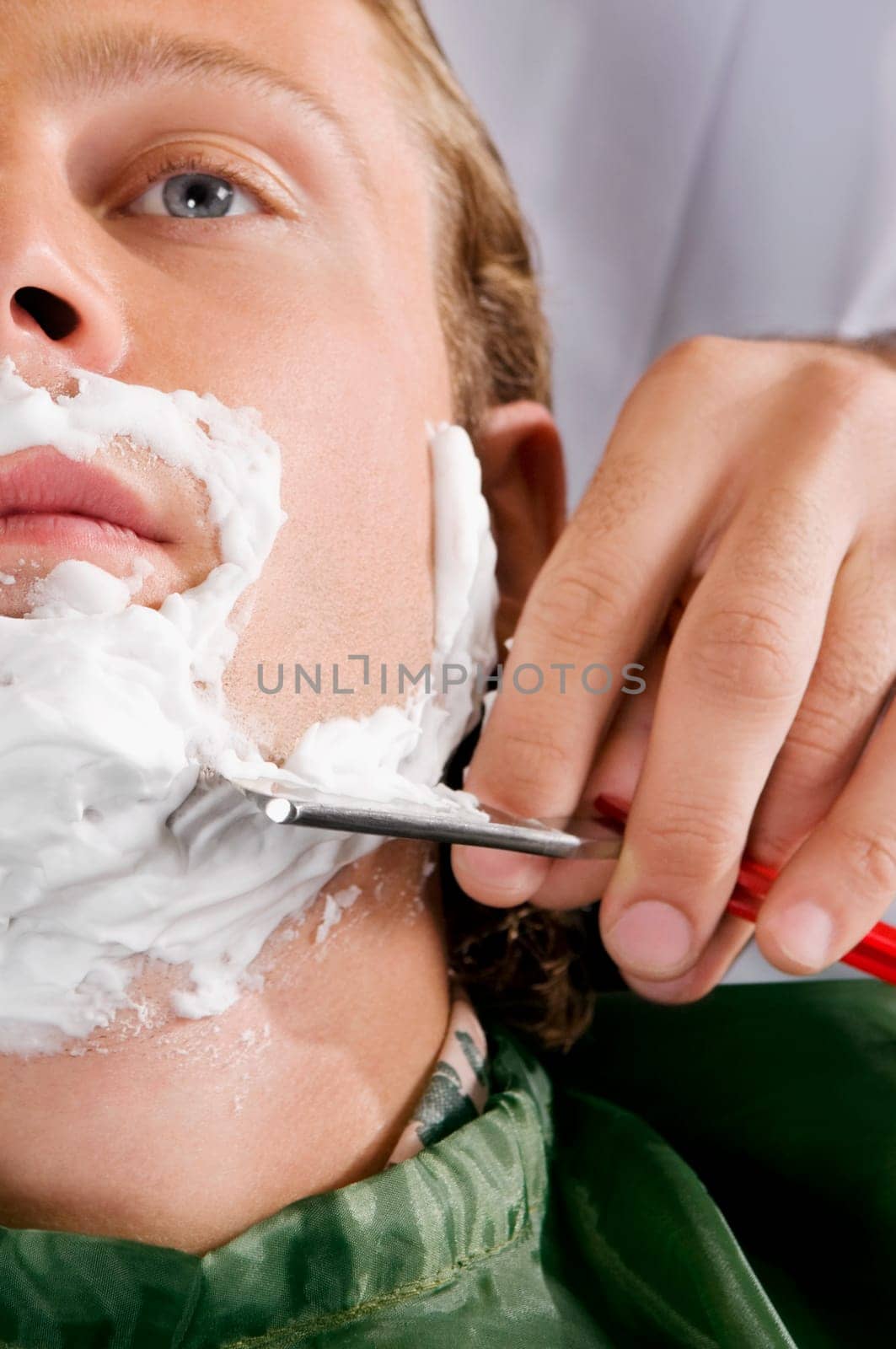 Man getting shaved in a salon