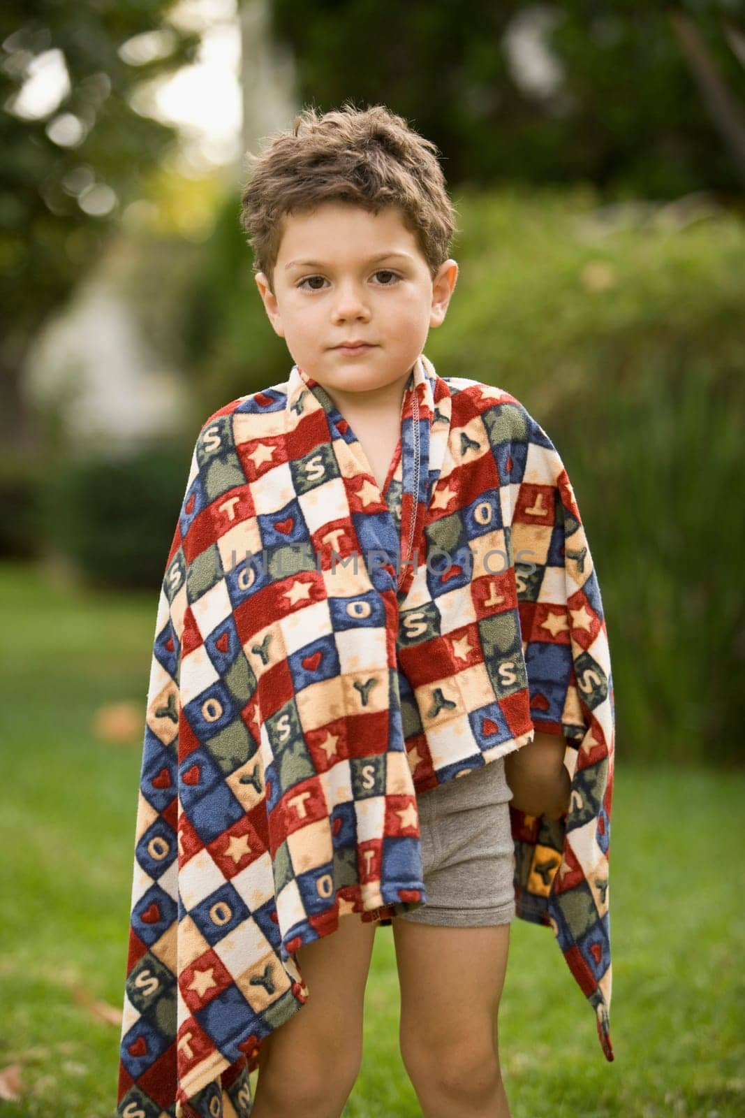 Portrait of a boy wrapped in a towel