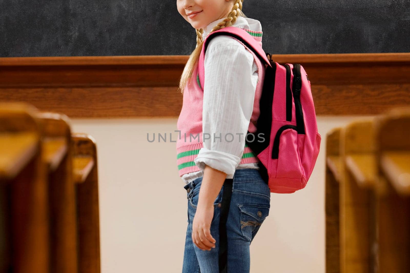 Girl standing in a classroom