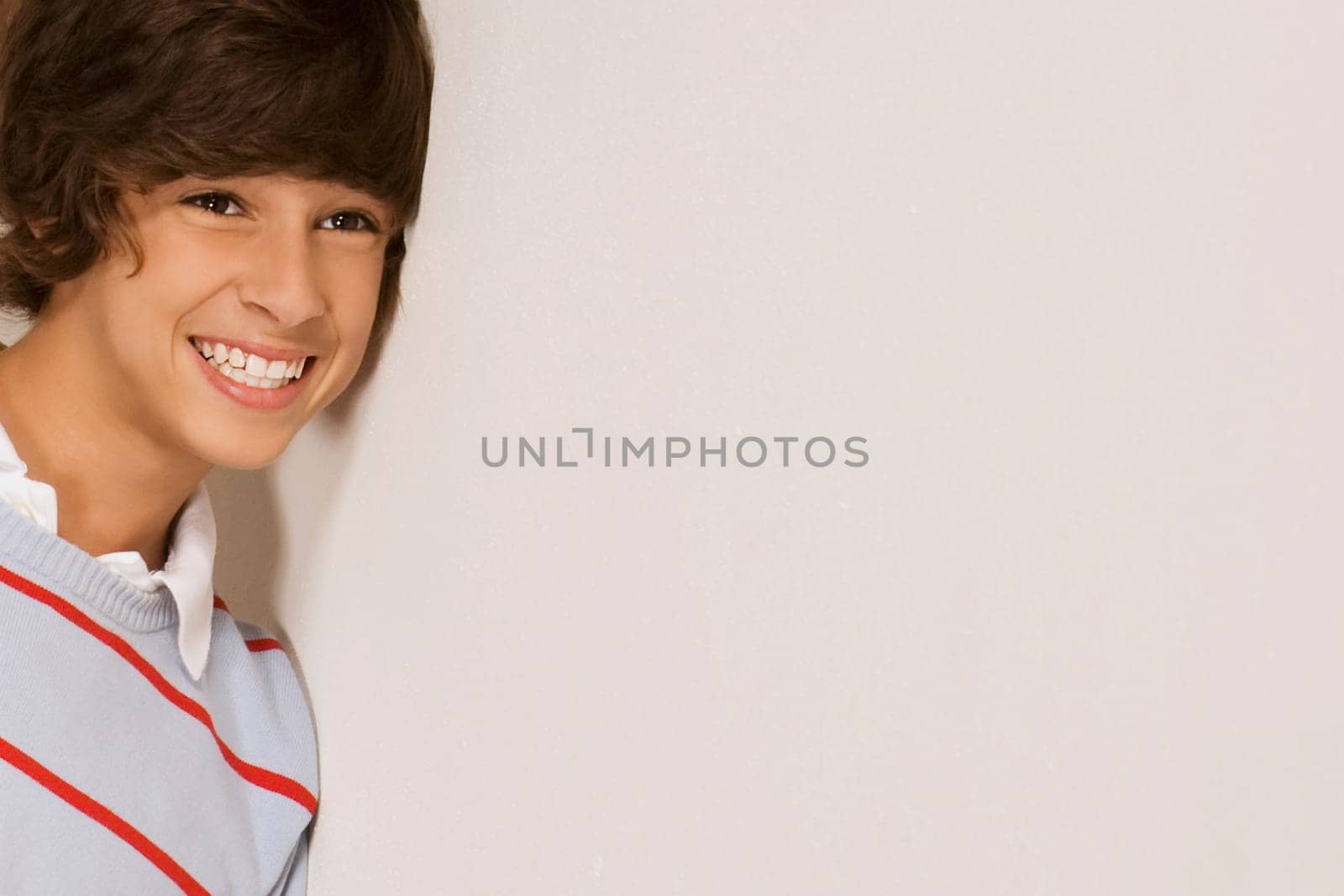 Close_up of a teenage boy smiling