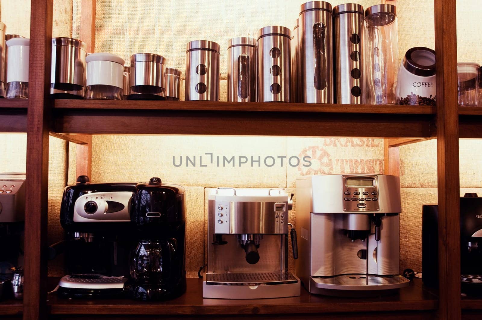 Coffee makers and containers on a rack