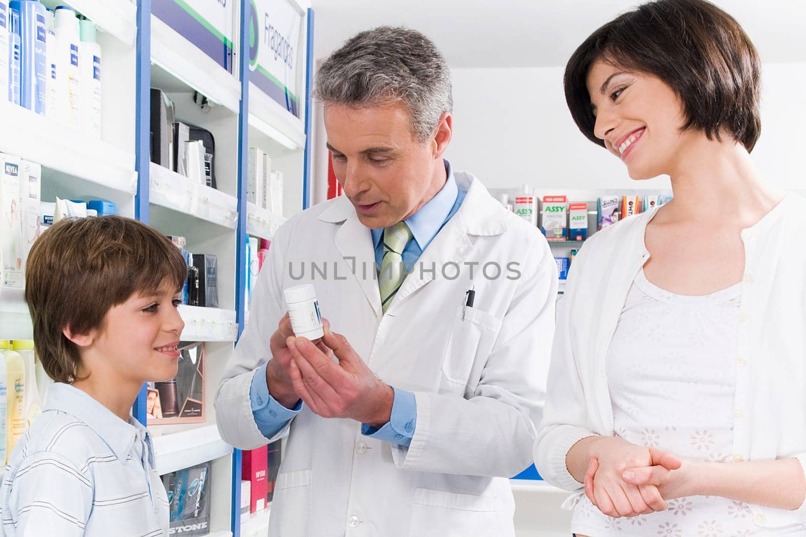 Pharmacist talking with a boy