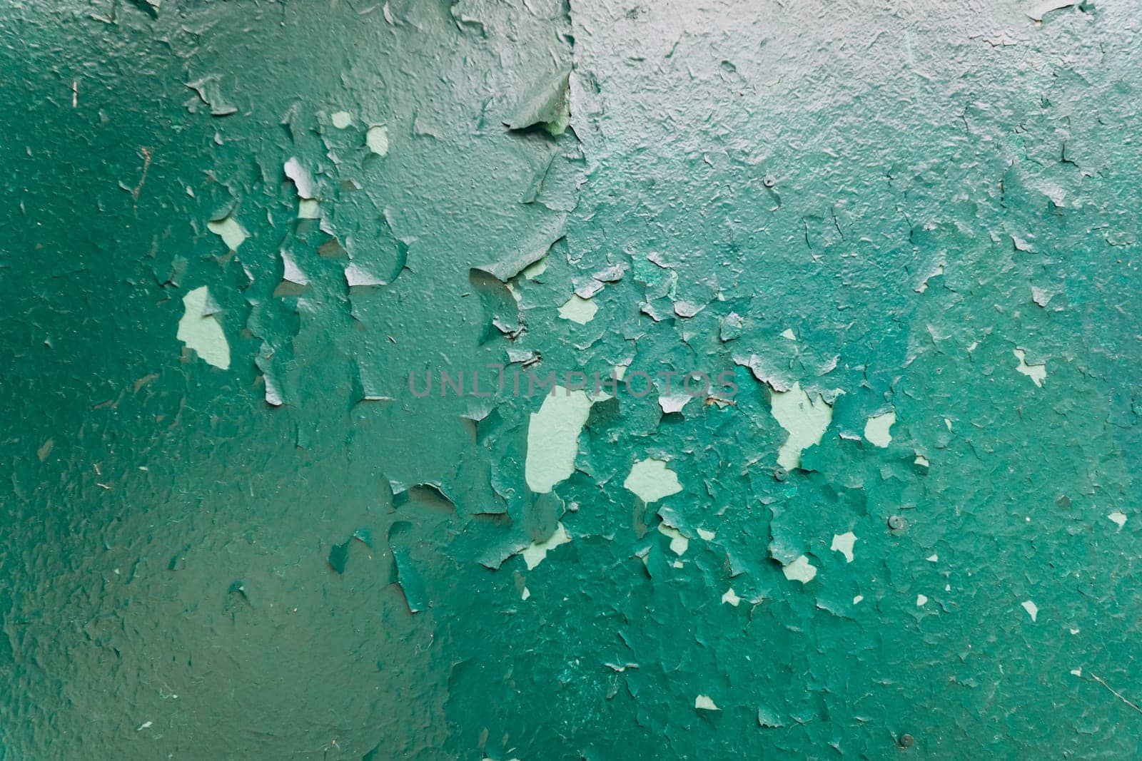 The old paint on the wood. The texture of the paint