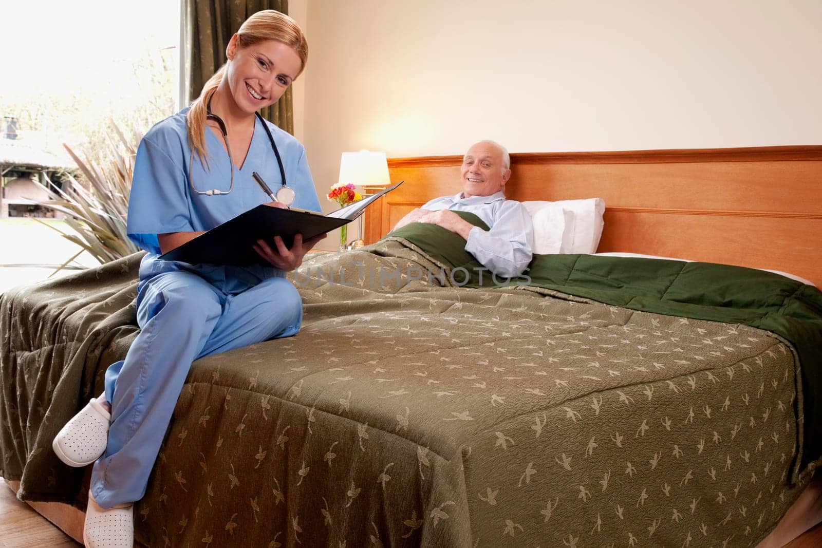 Female nurse preparing the medical report of a patient
