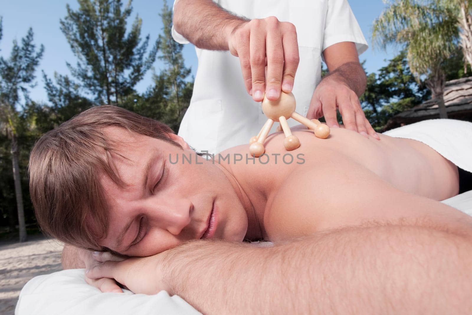 Man receiving acupressure treatment