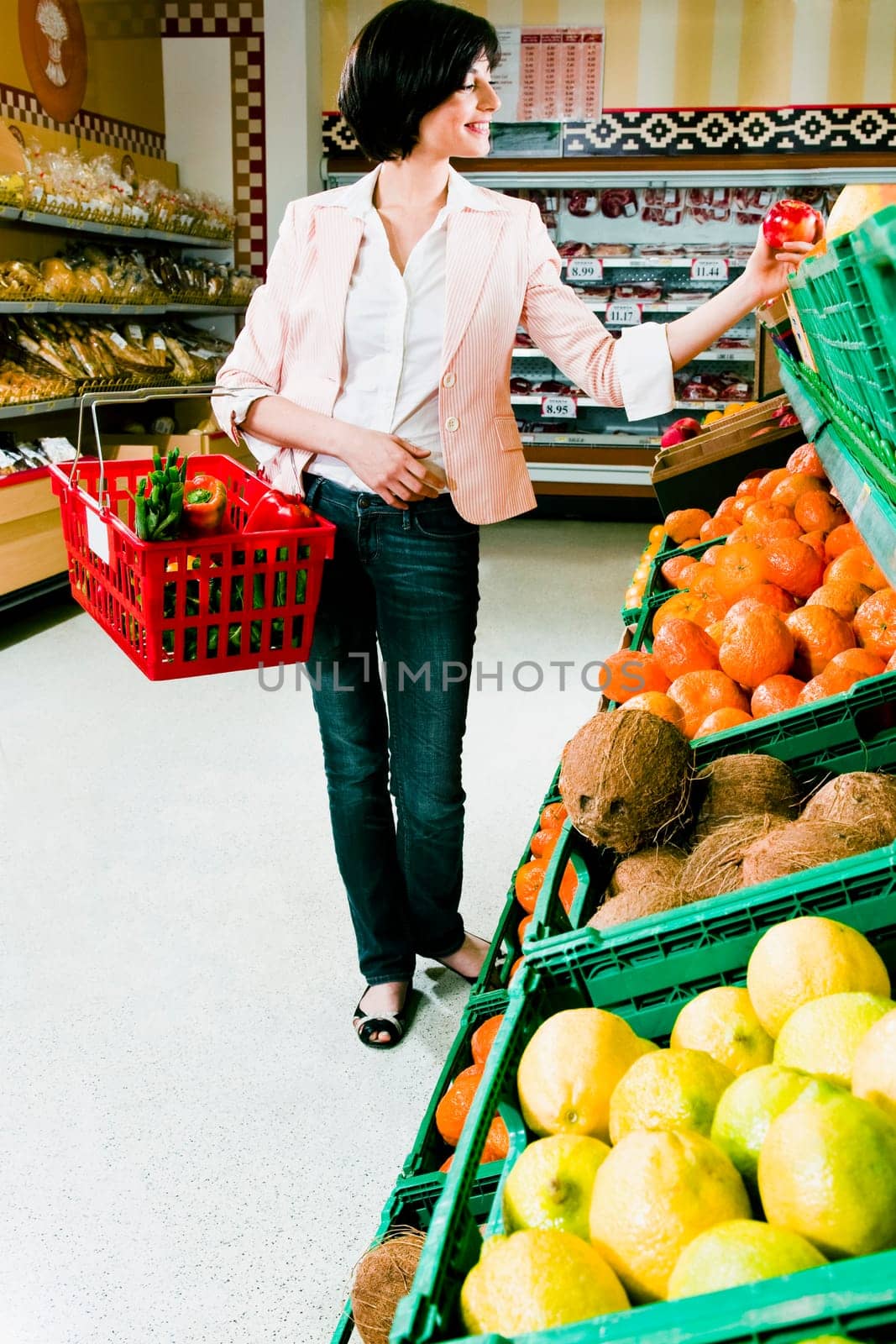 Woman buying fruits in a supermarket
