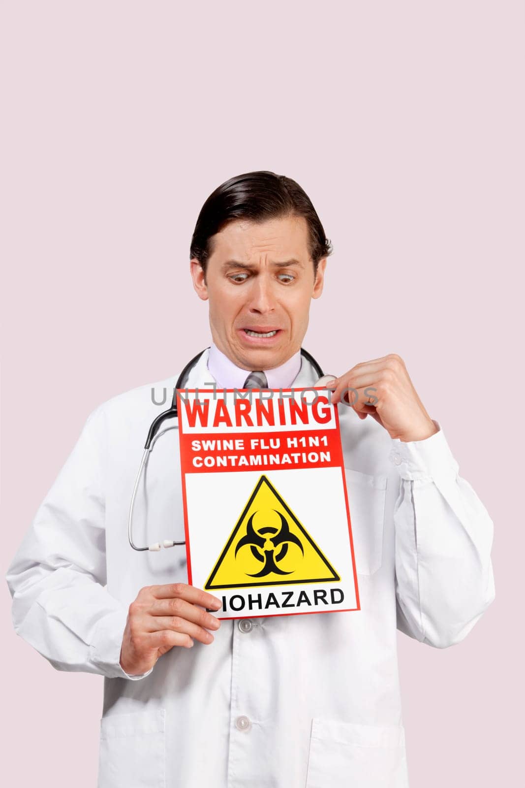 Doctor showing a Biohazard warning sign and crying