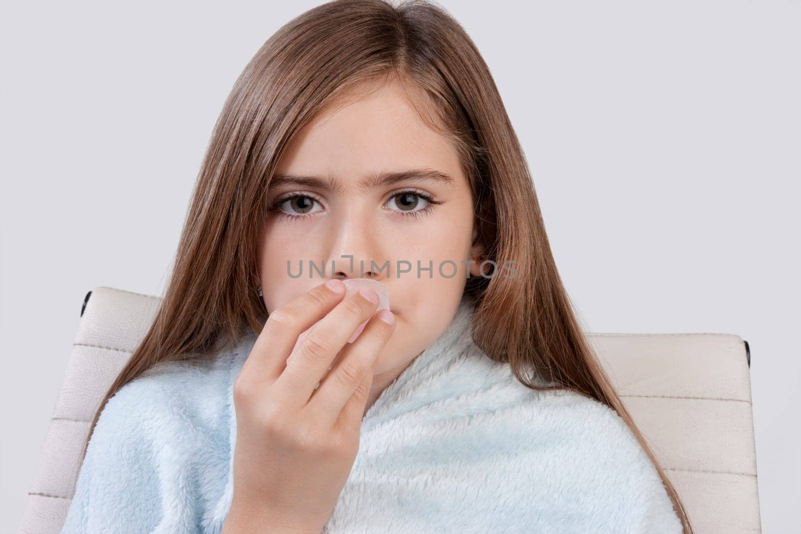 Portrait of a girl taking medicine