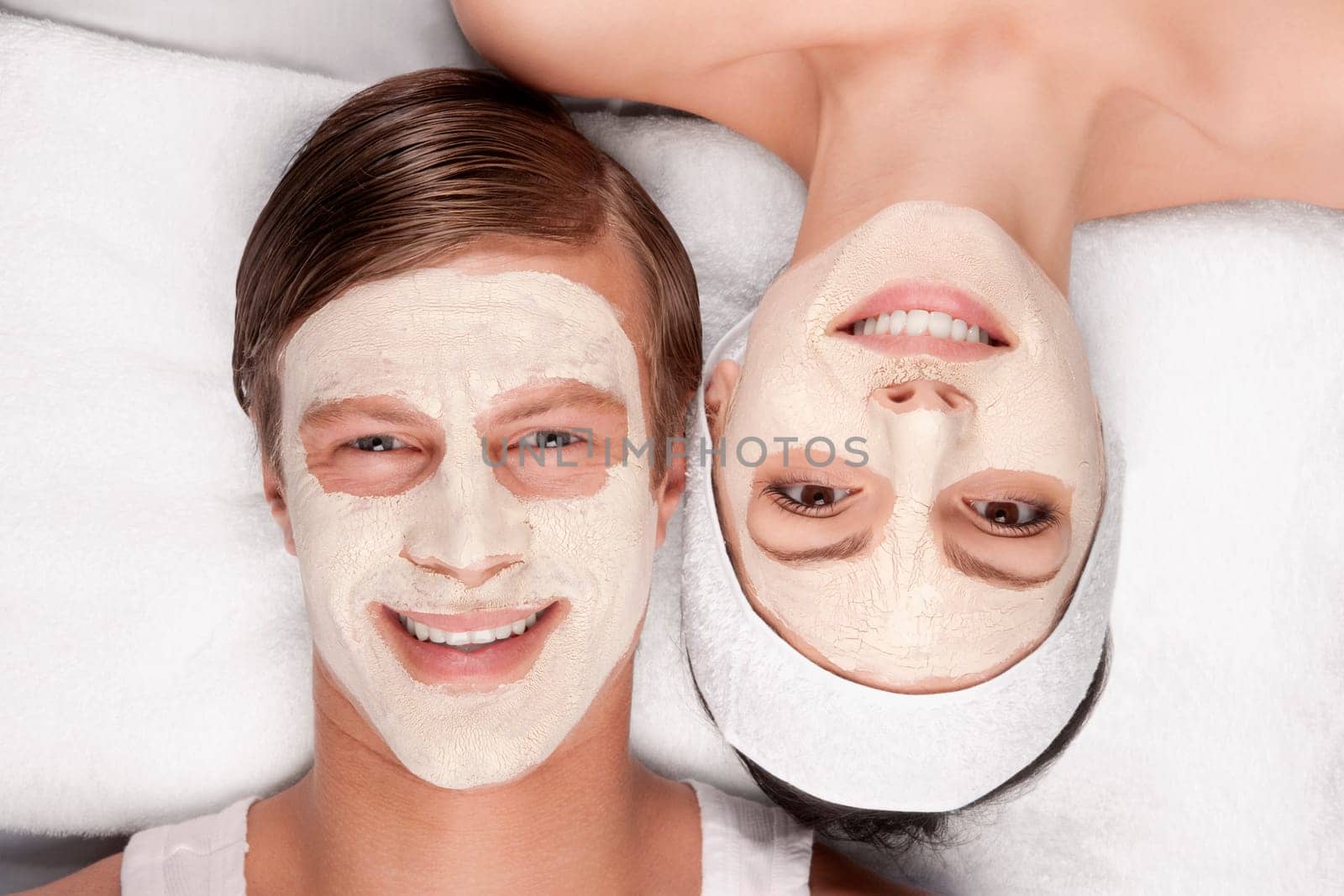 Couple with face pack on their faces