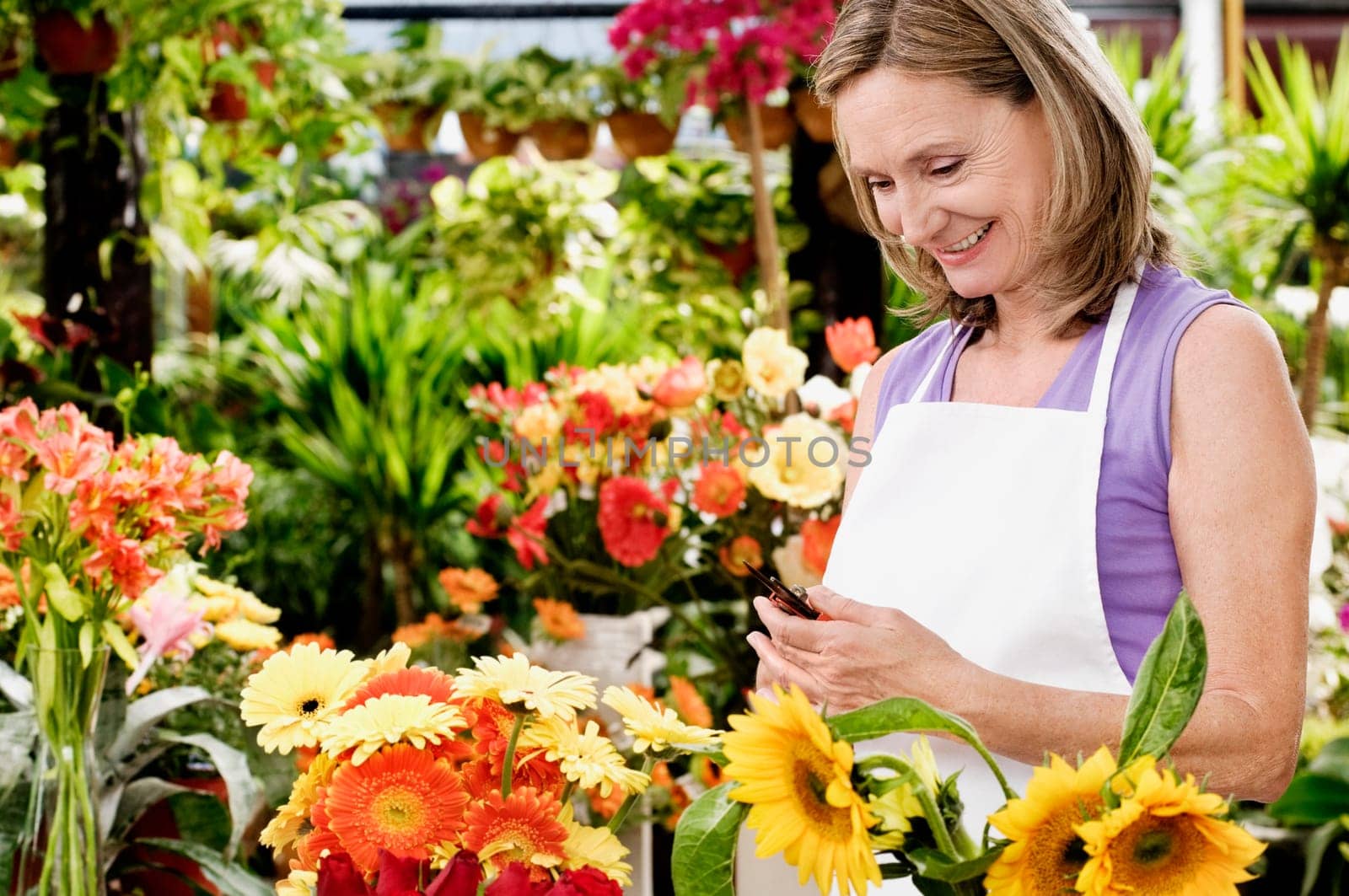 Female florist holding pruning shears