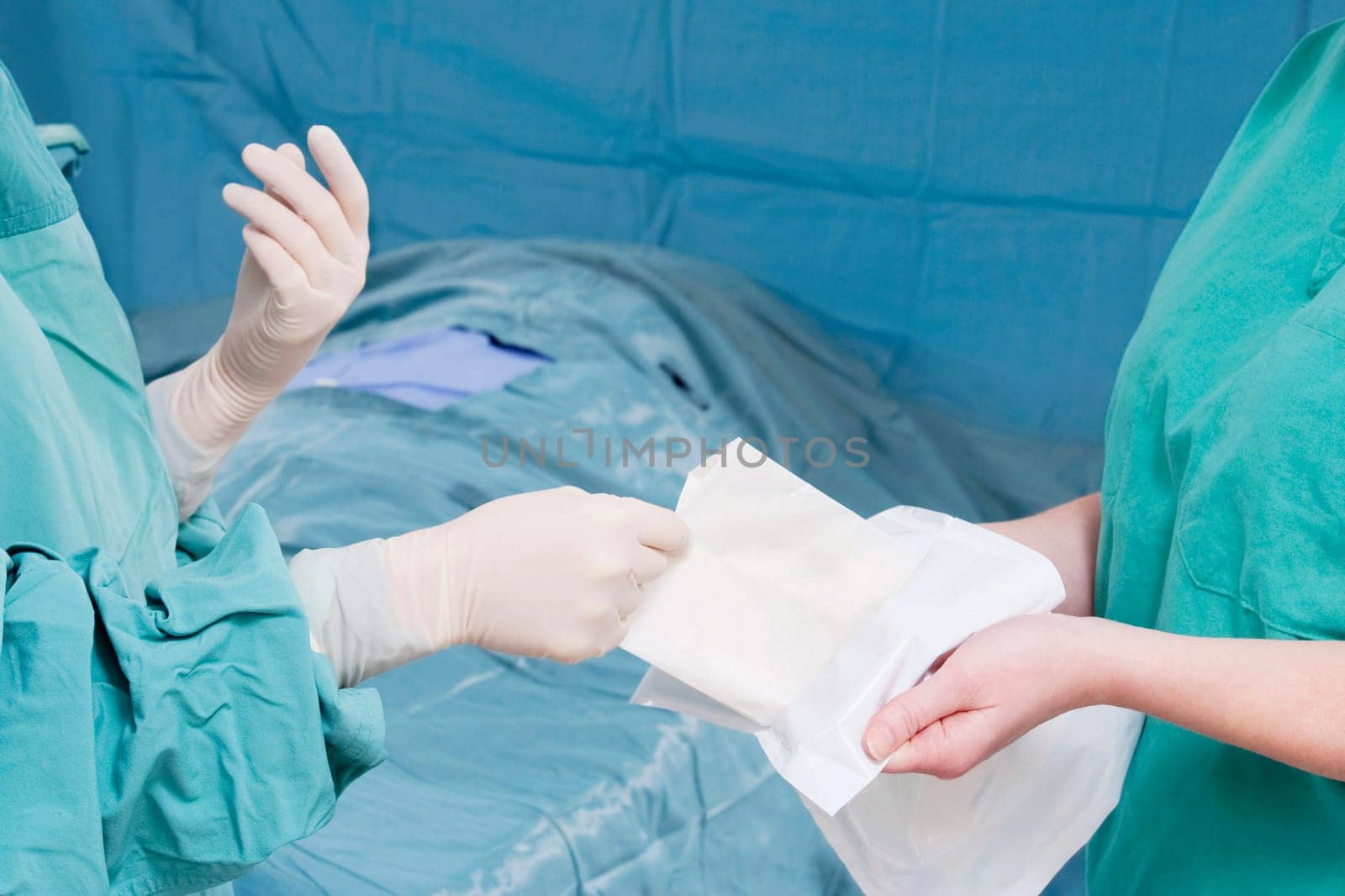 Two surgeons performing a surgery in an operating room
