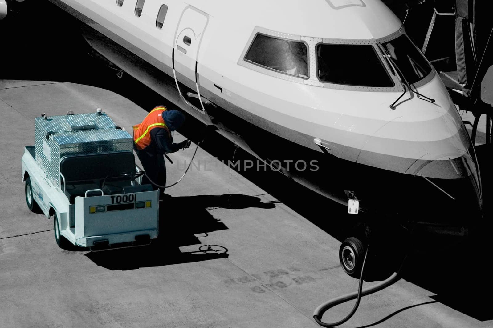 Airplane being refueled at an airport