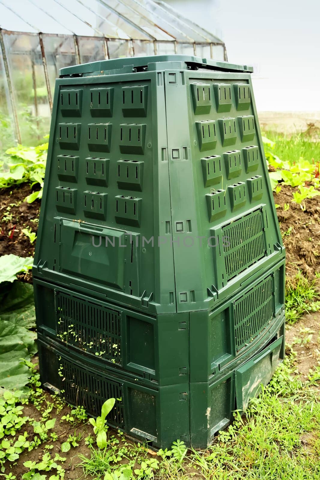 Big composter for recycling of garden refuse and kitchen food waste.