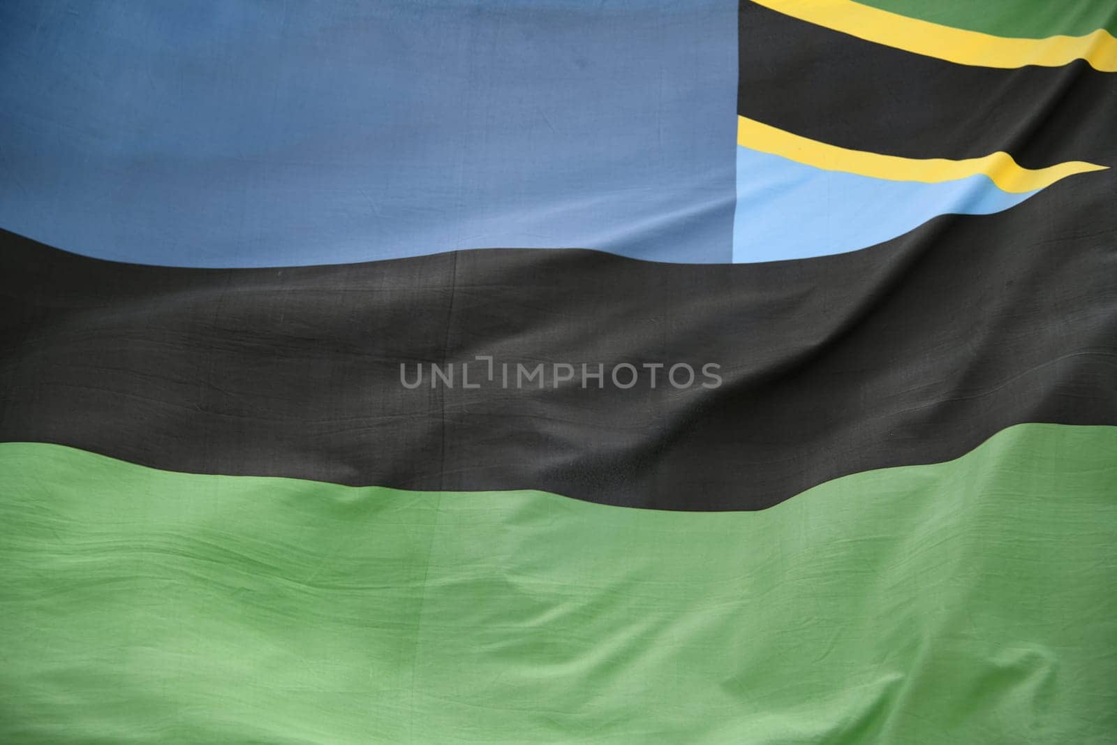 In the wind the national flag,banner of the island of Zanzibar after the union with Tanzania since January 10,2005. The blue represents the Indian Ocean.