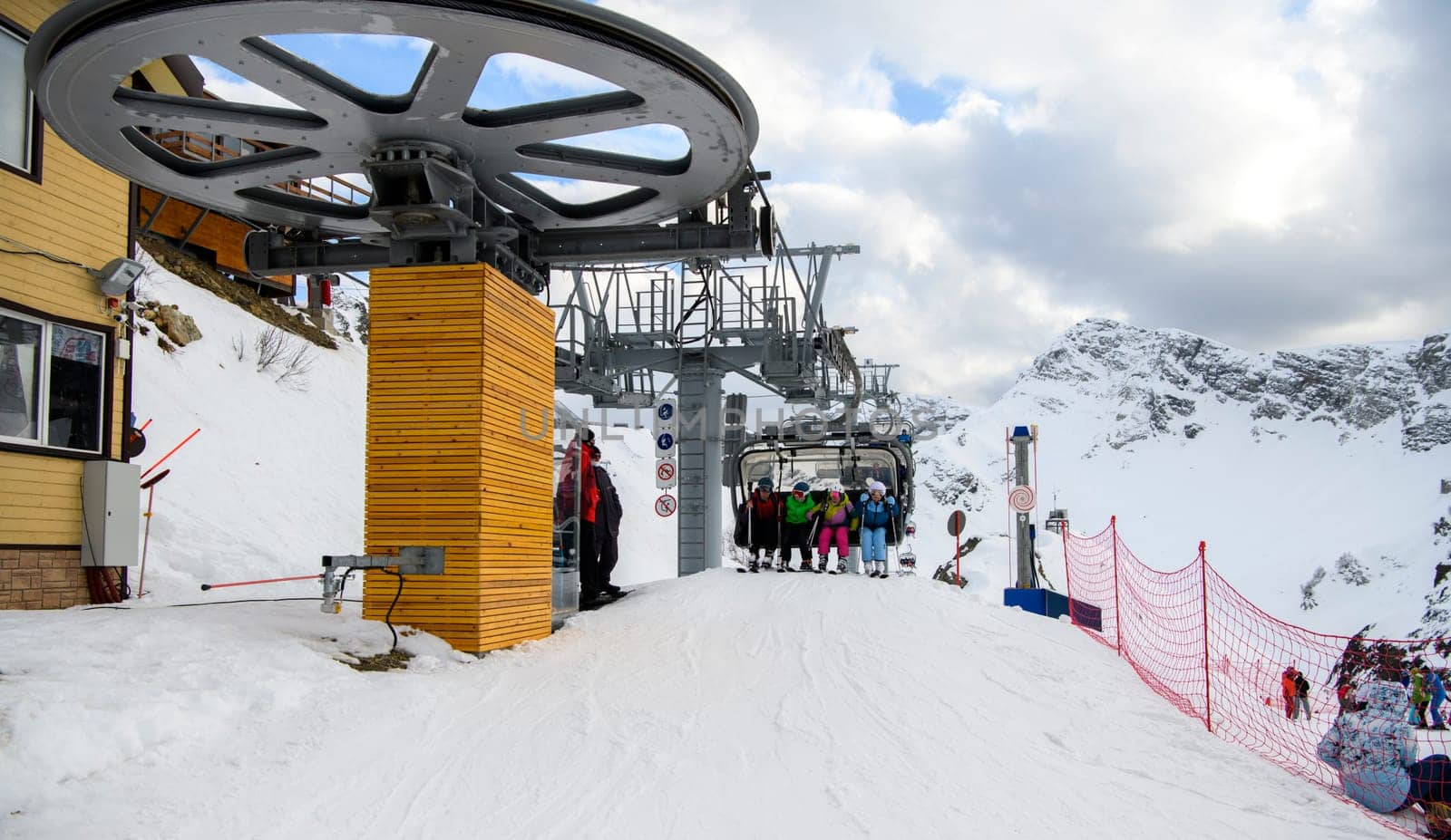 Sochi  Russia - January 02  2021: Skiers climb the cable car at the Krasnaya Polyana ski resort