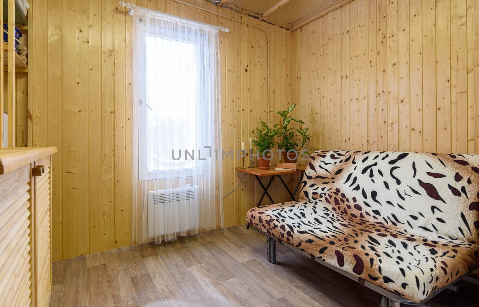 Interior of a small modest living room of a country house