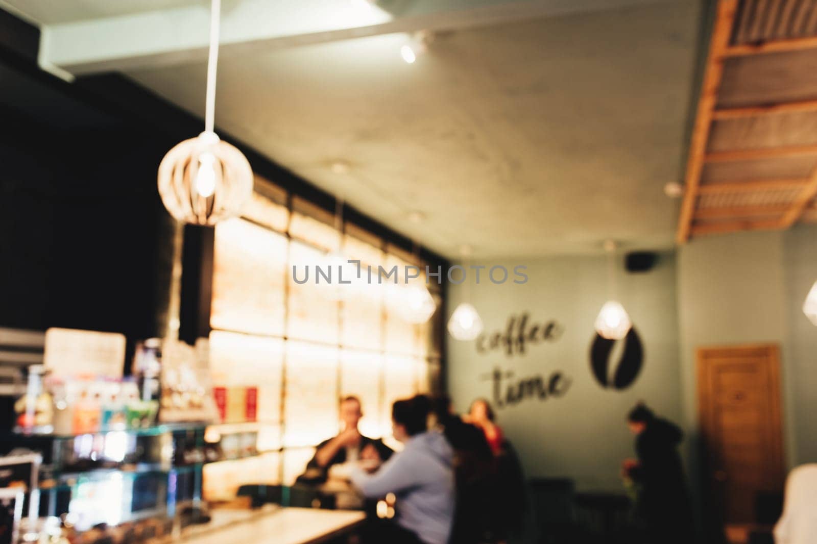 Blurred loft coffee shop with barista and customer. High quality photo