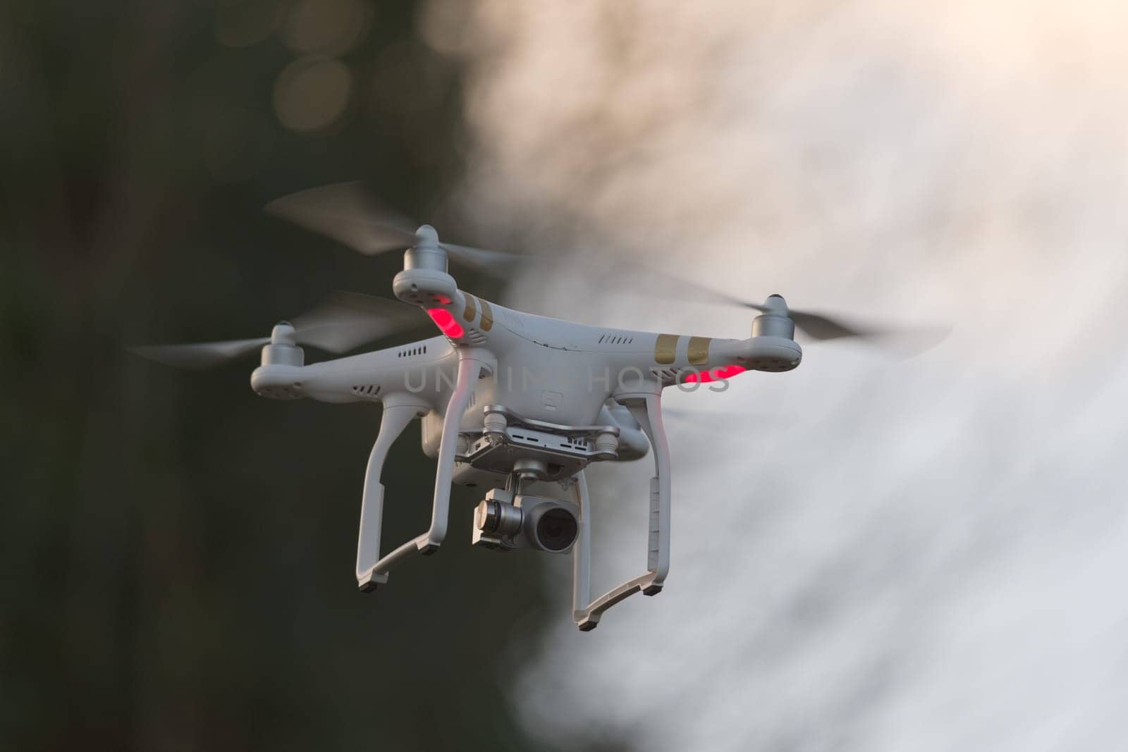 Great Malvern, United Kingdom, 27th December, 2020: Camera drone with blurred background and plenty of copy space. Sunset colors and evening light