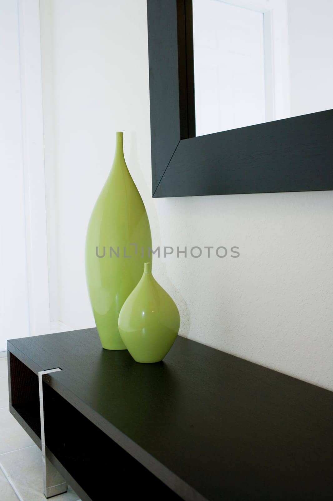Two decorative urns on a cabinet