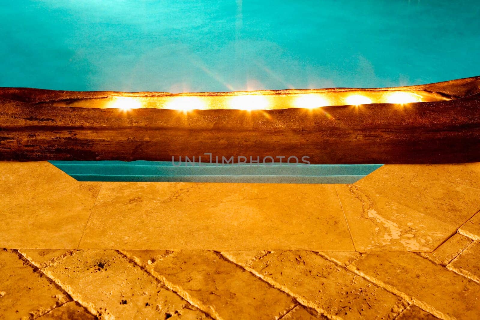 Close-up of electric lights at the poolside