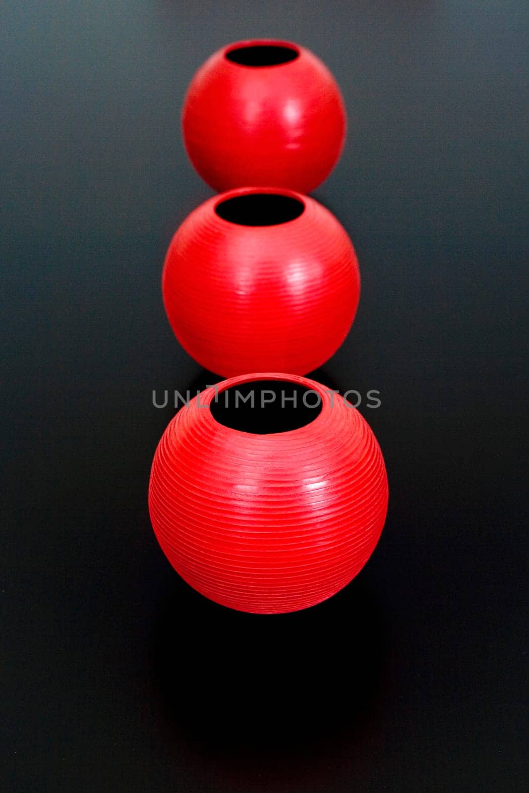 Close-up of three decorative urns in a row