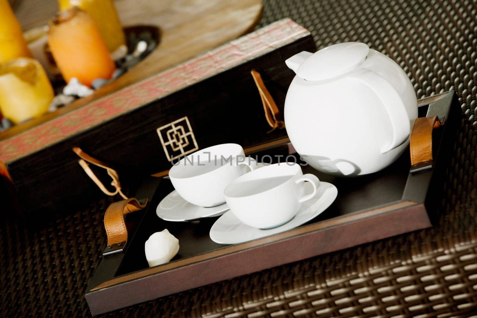 Close-up of a teapot with teacups on a serving tray