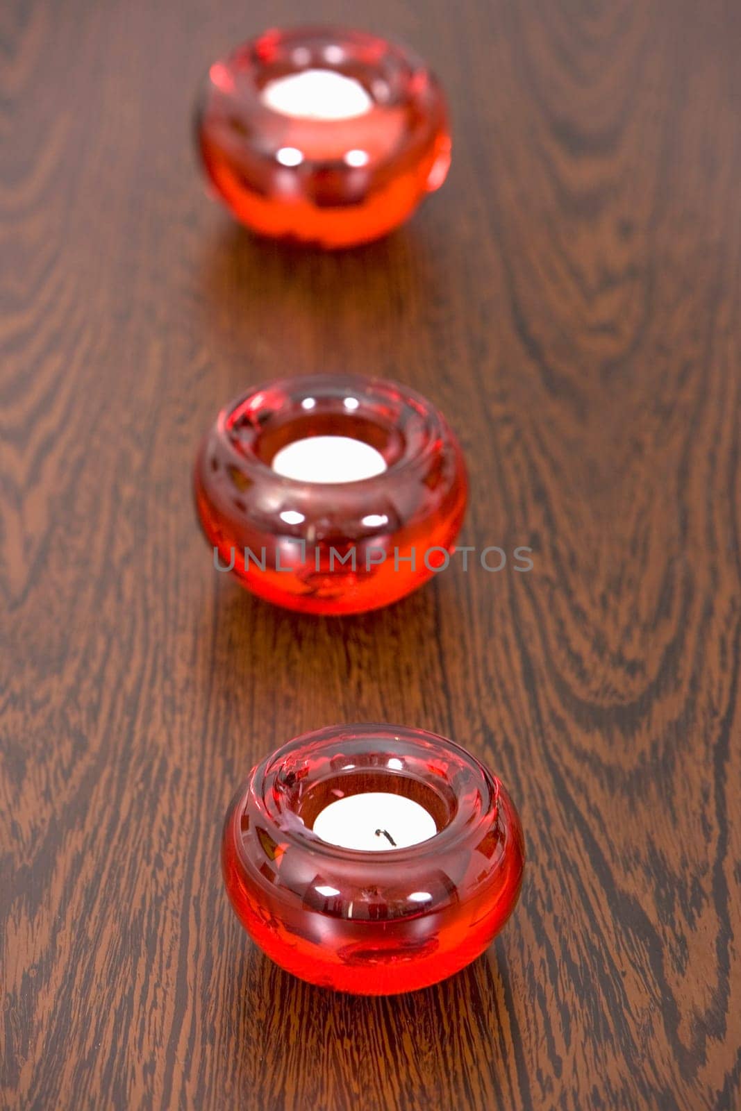 Close-up of three candles on a table