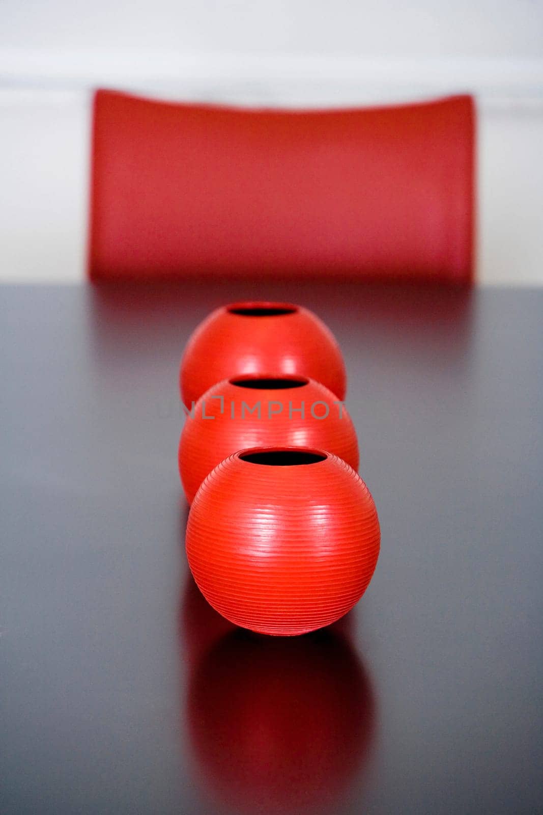 Decorative urns on a dining table in a dining room