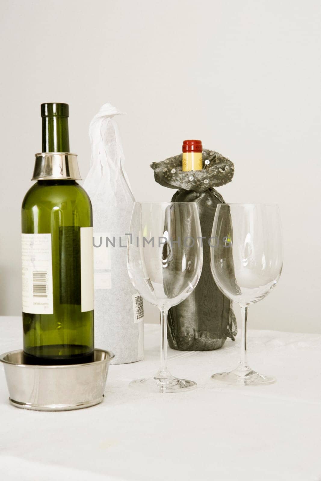 Wine bottles and two wine glasses on a dining table