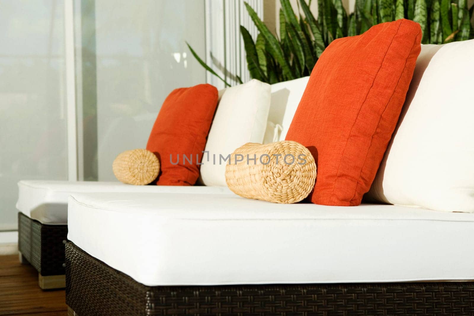 Close-up of cushions on chairs in a living room