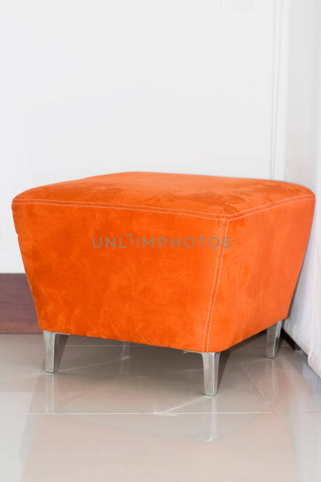 Close-up of a stool in a corner