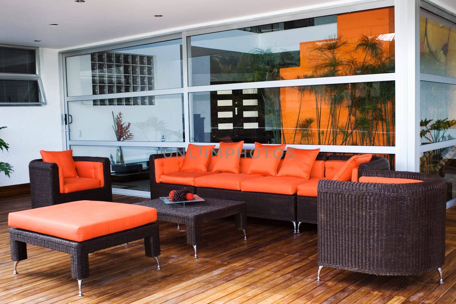 Couch and armchairs in a patio of a house