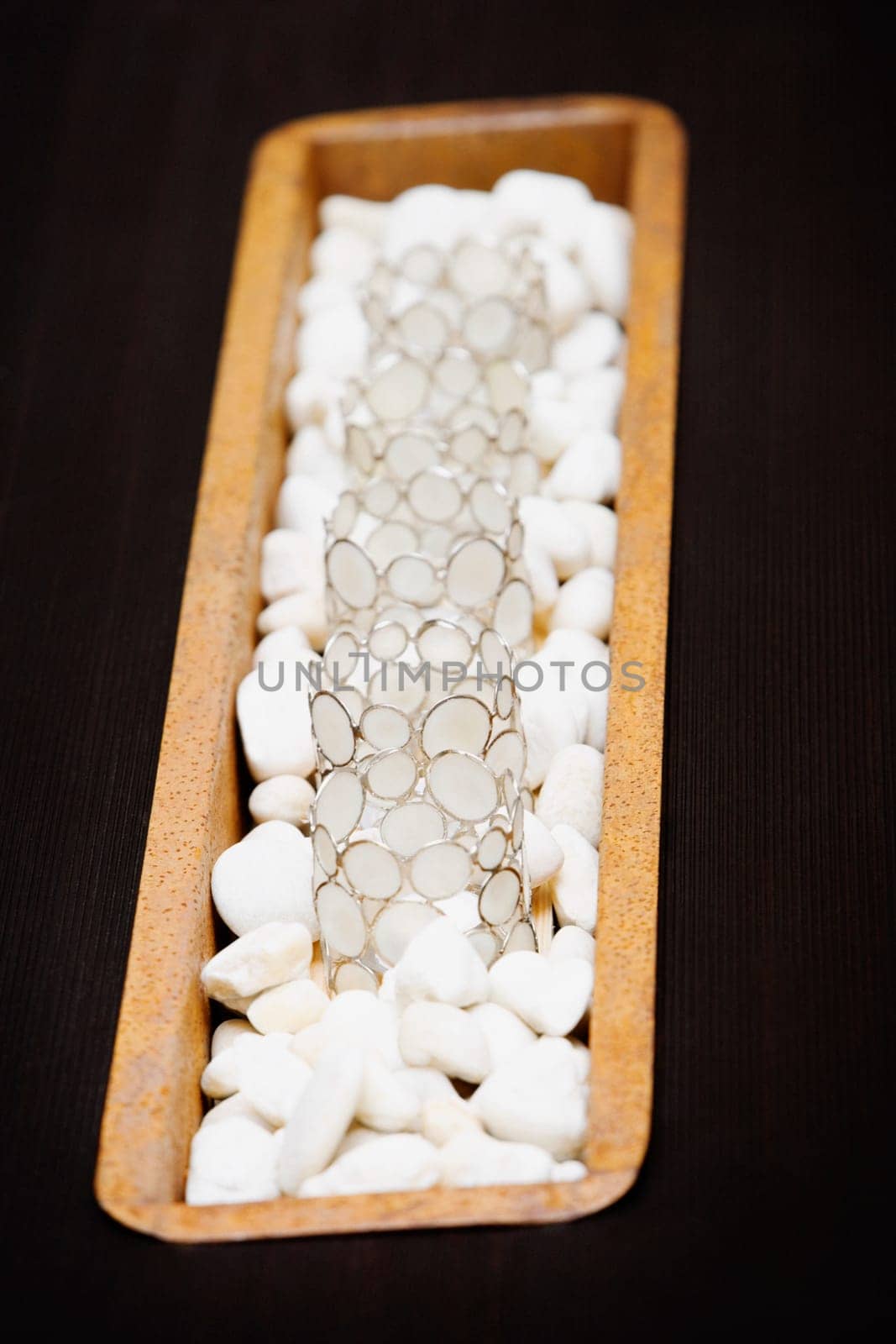 Close_up of decorative glasses on pebbles