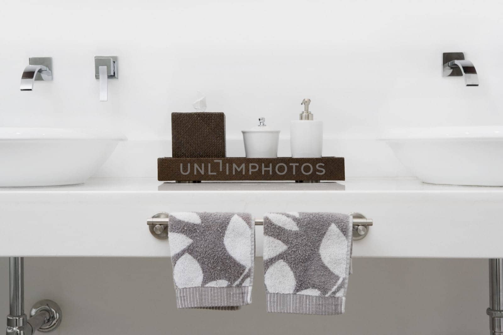 Soap dispensers and towels in the bathroom