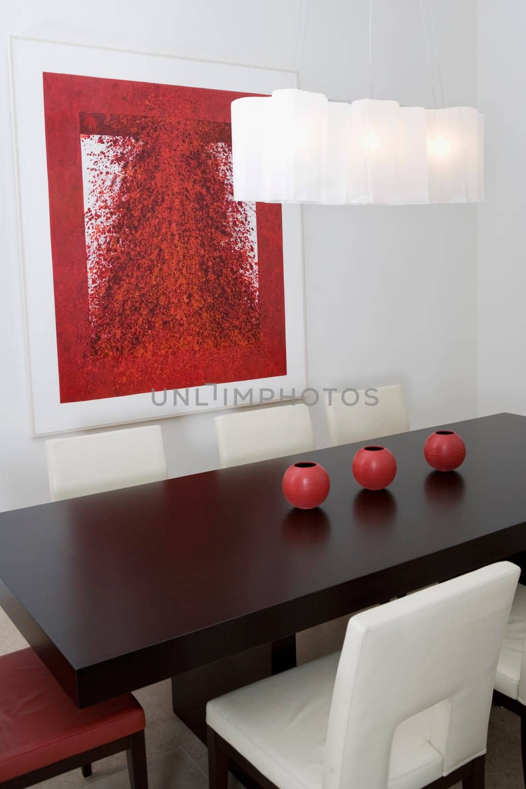 Decorative urns on a dining table in a dining room