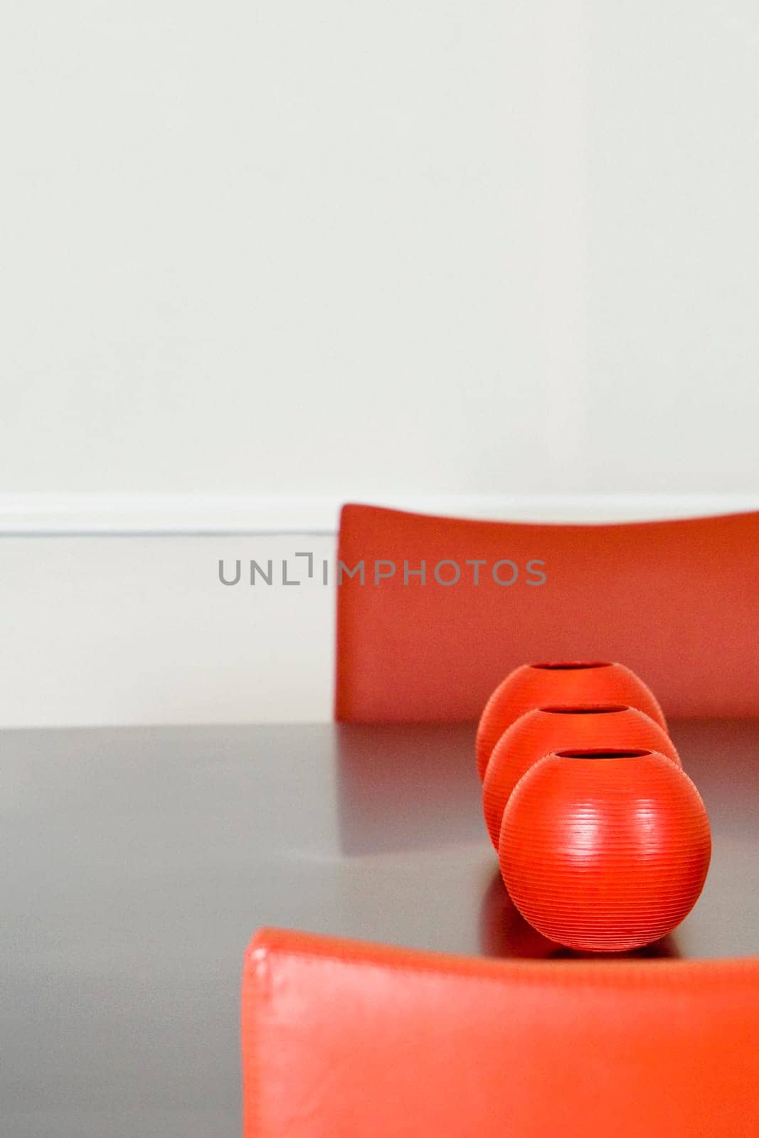 Decorative urns on a dining table in a dining room