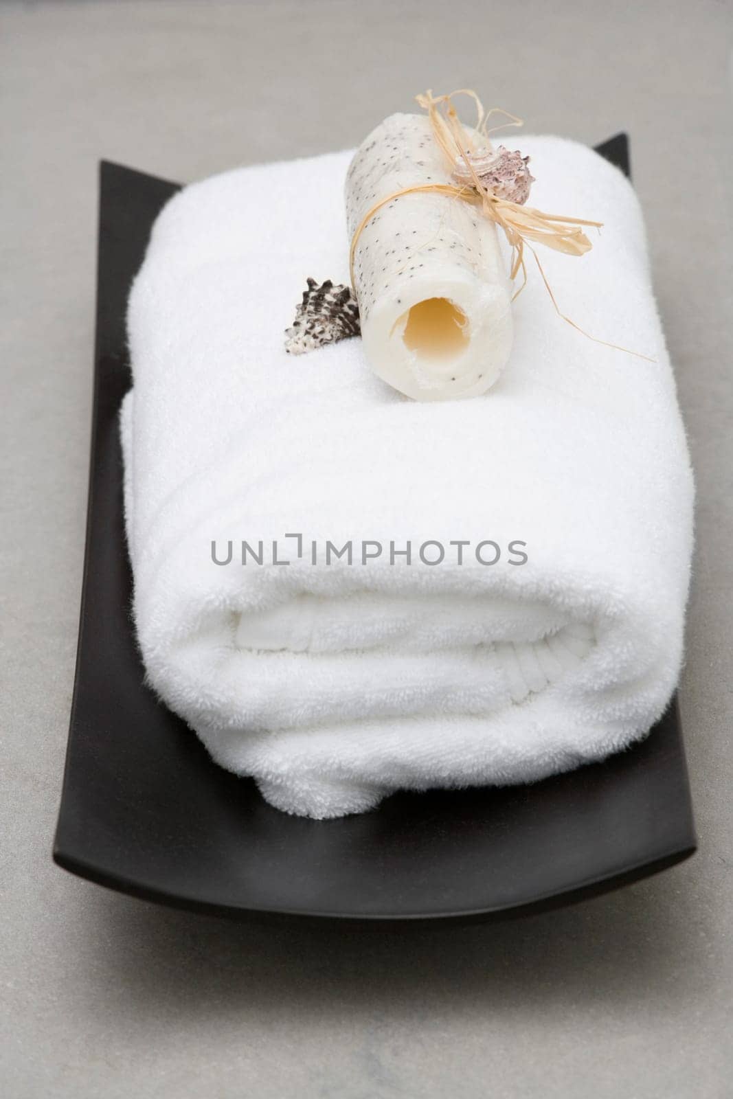 Close_up of a towel with a loofah