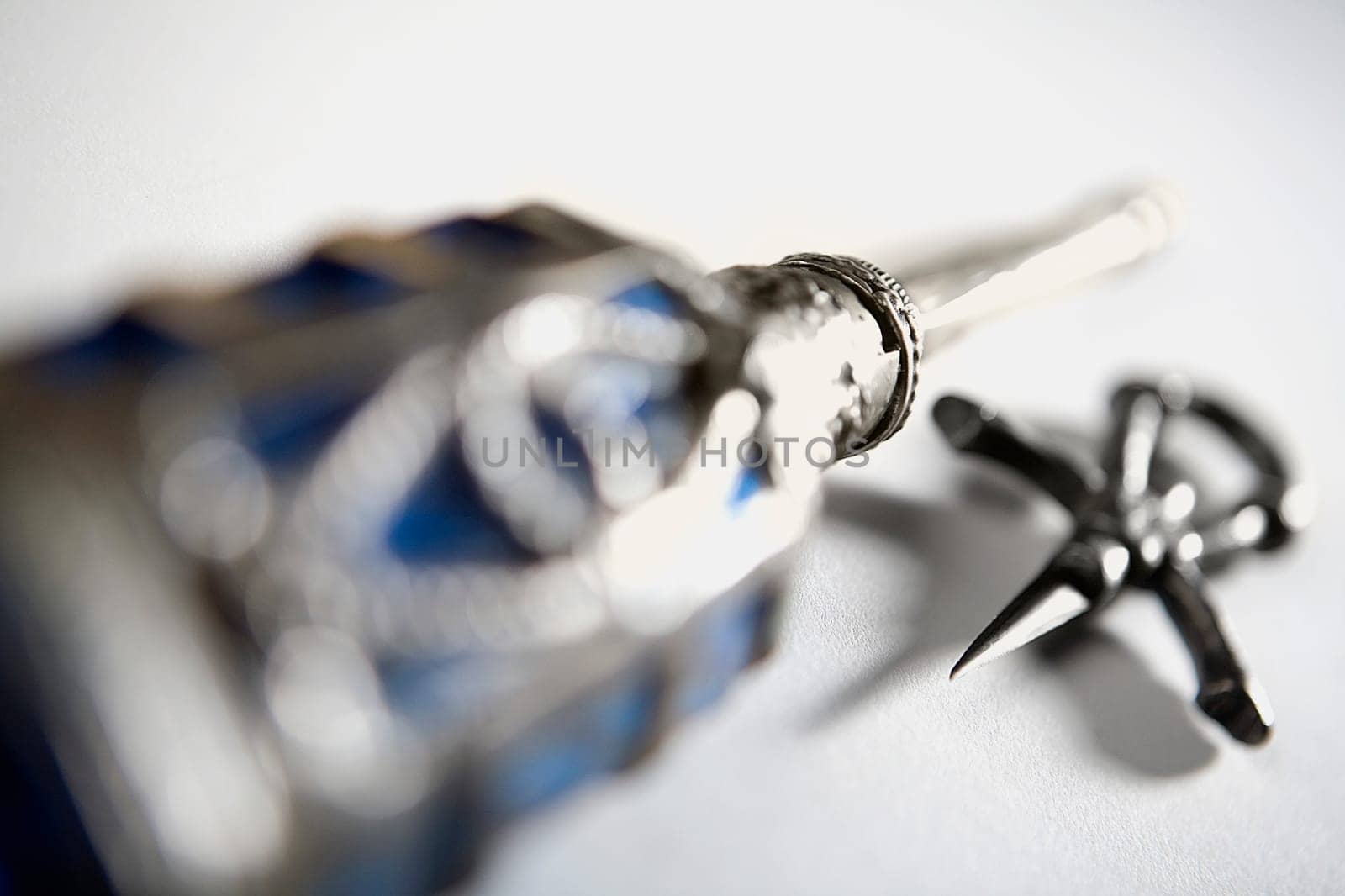 Close-up of an ornate bottle and pendant