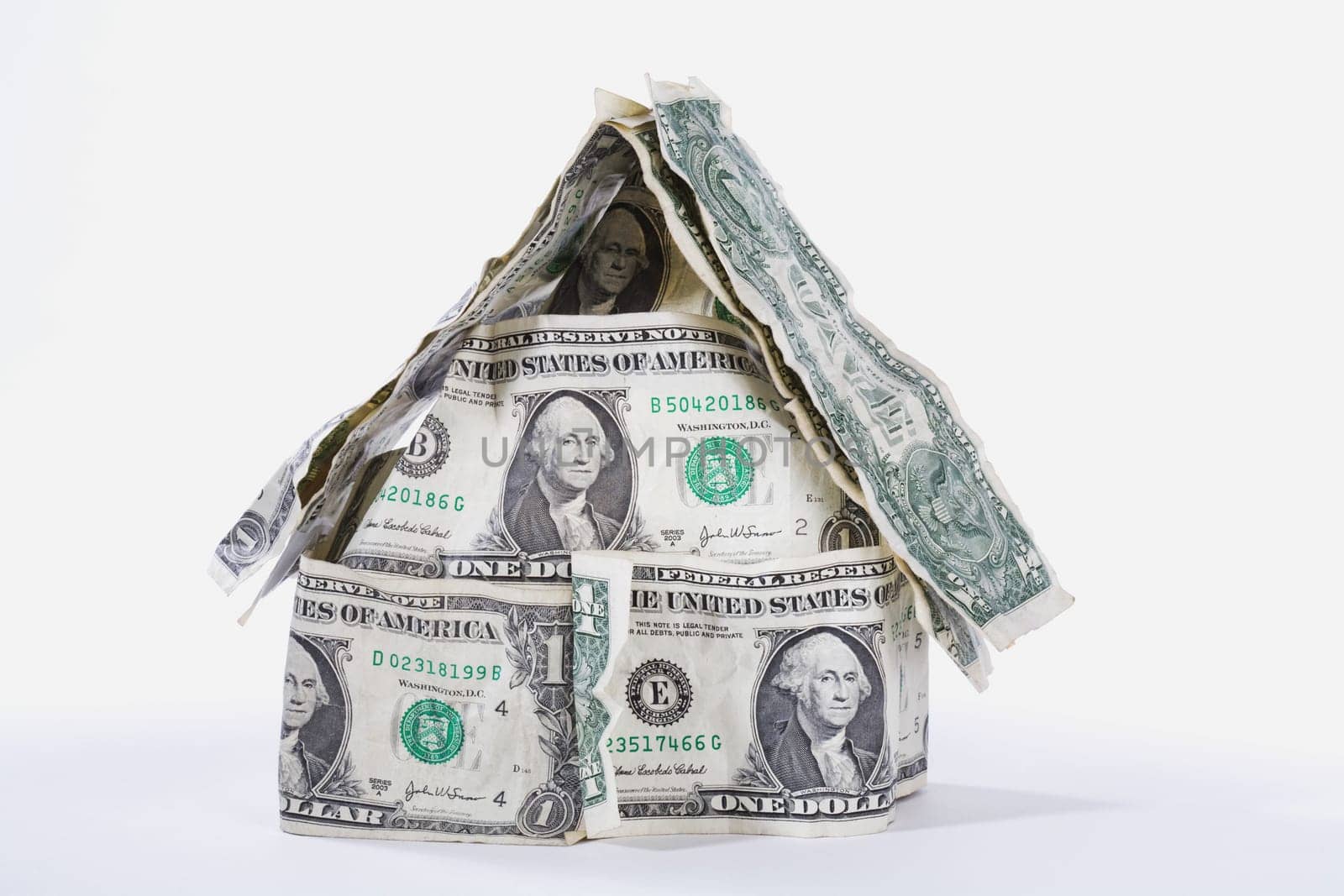 Miniature house made up of US dollar bills