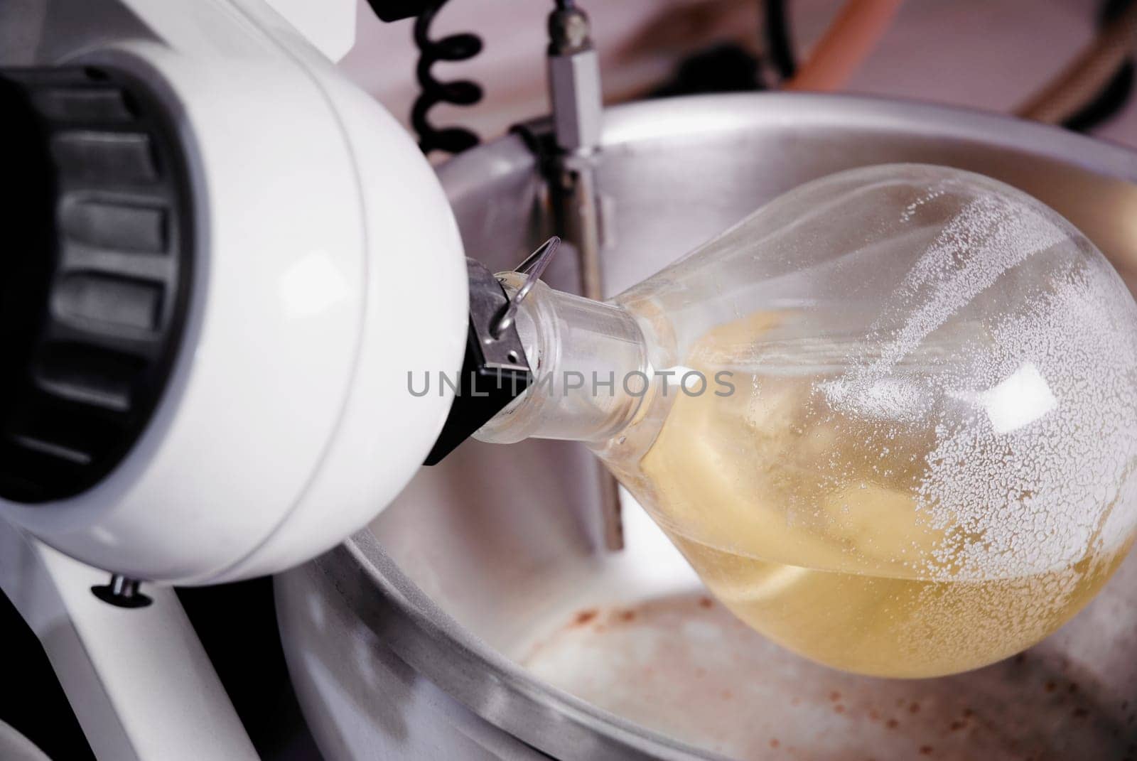 Close-up of a flask attached to laboratory equipment
