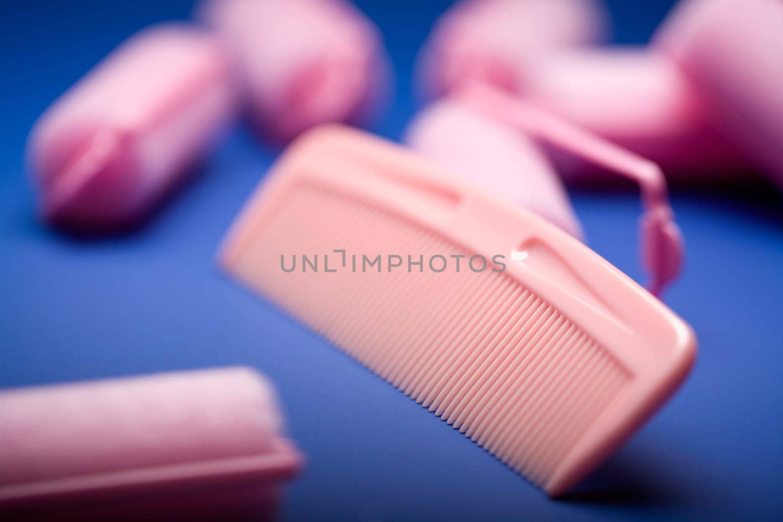 Close-up of a comb and hair curlers