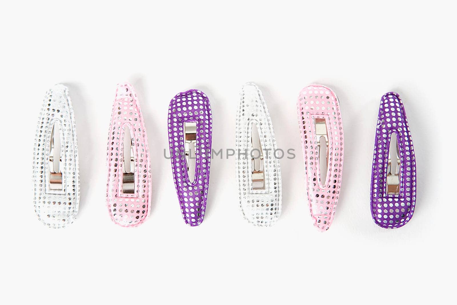 Close-up of a group of hair clips in a row