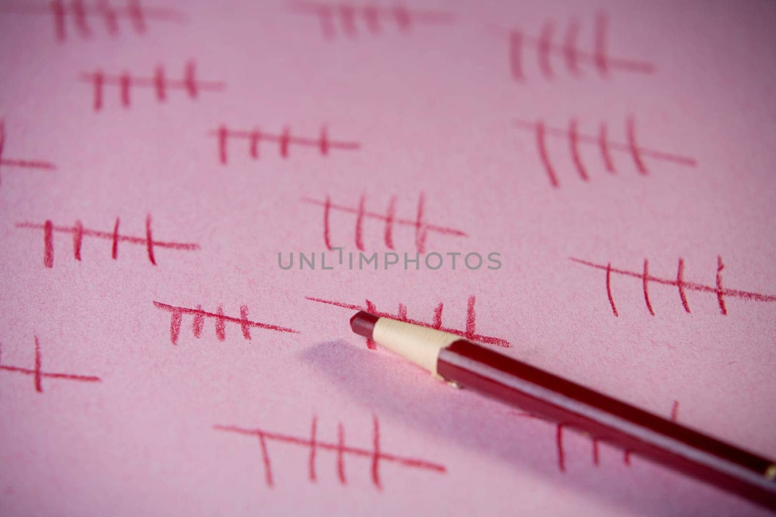 Close-up of a colored pencil on a sheet of paper