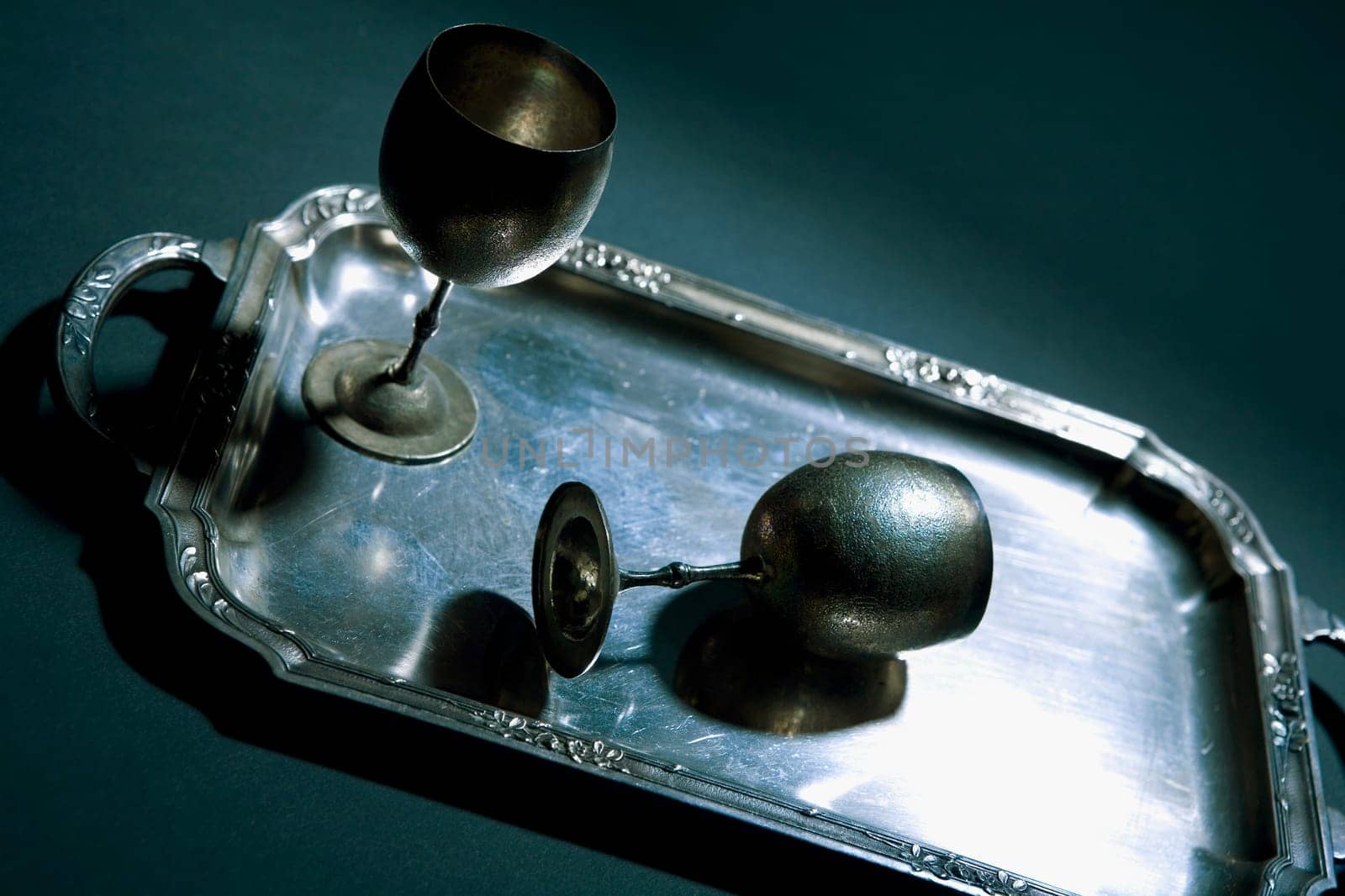Close-up of two wine goblets on a tray