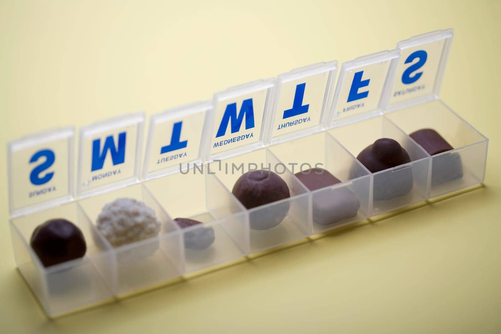 Close-up of nuts in a plastic pill box