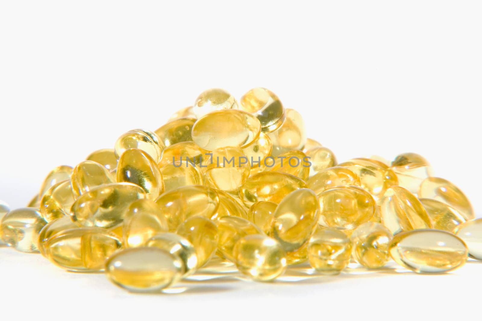 Close-up of a heap of vitamin E capsules