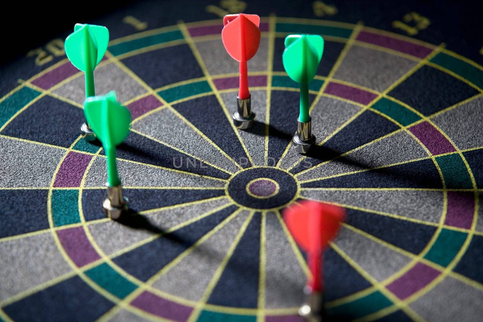 High angle view of darts on a dartboard