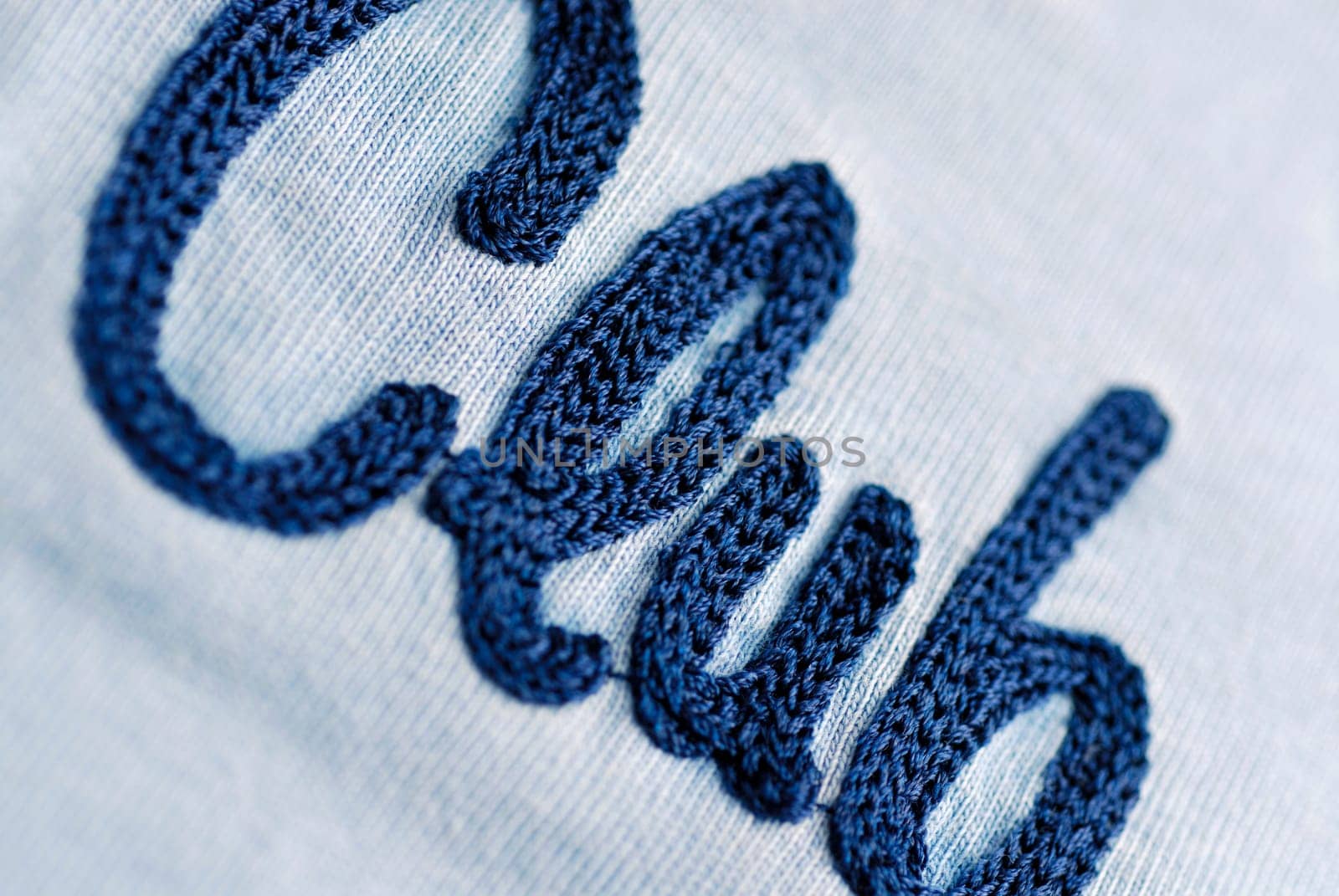 Close-up of text woven on fabric