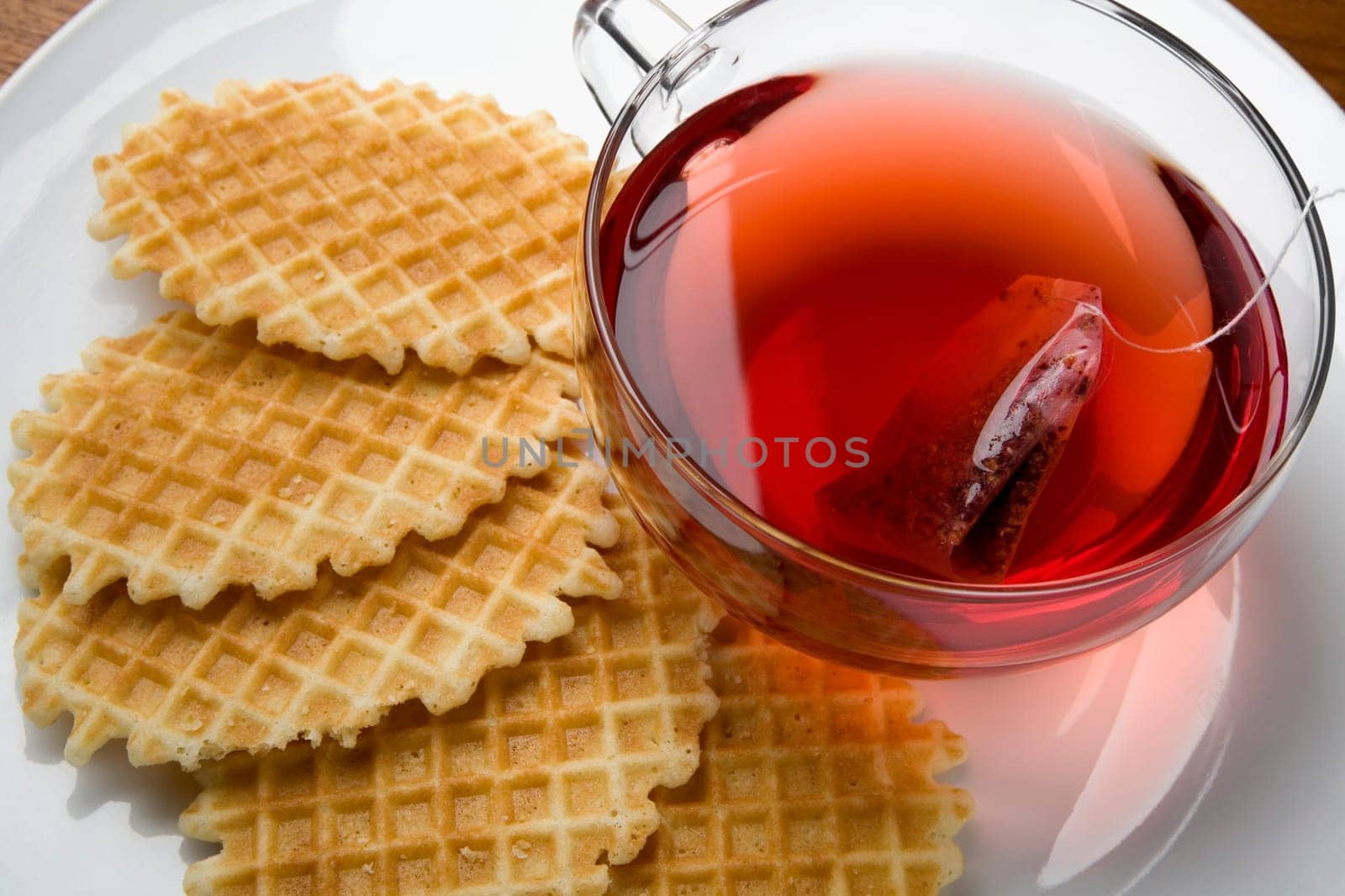 Close-up of waffle with a cup of tea