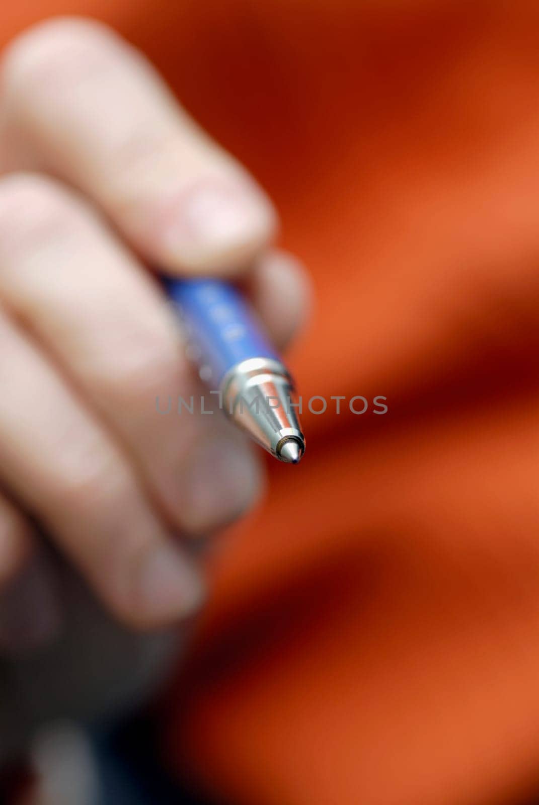Close-up of a personŽs hand holding a ballpoint pen